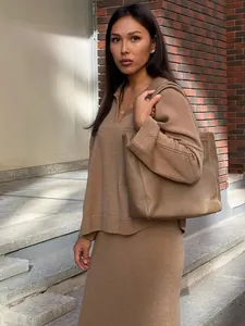Elegant V-neck knit sweater and midi skirt set in khaki featuring soft knit texture