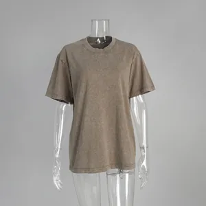 Detailed shot of a vintage washed distressed brown crew neck T-shirt on a mannequin
