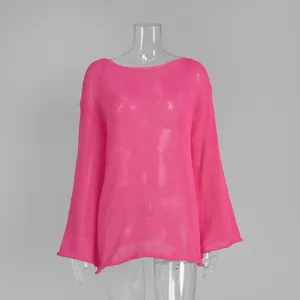 Close-up view of a pink hollow-out knit top with stylish flared sleeves on a mannequin