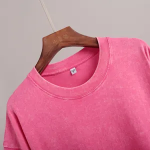 Detailed macro view of pink washed vintage cotton T-shirt neckline texture