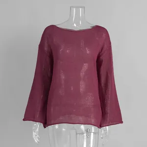 Detail of sheer maroon knit sweater with wide boat neck and elegant bell sleeves