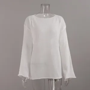 Detailed front view of white sheer hollow-out knit sweater with elegant flare sleeves