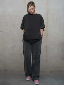 Full body view of a woman wearing a vintage charcoal grey washed oversized t-shirt set.