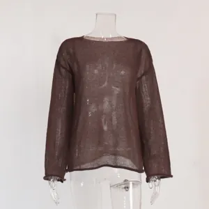 Detailed view of a brown sheer hollow knit sweater featuring elegant flare sleeves