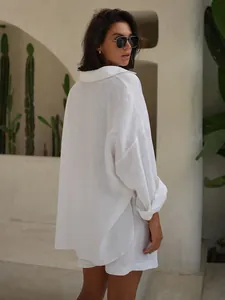Oversized white linen shirt and shorts set for women in casual summer resort style.