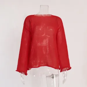 Detailed view of a red sheer hollow-out knitted sweater with elegant flare sleeves.