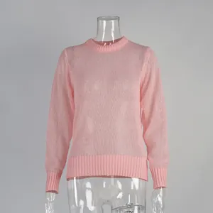 Detail view of pink semi-transparent crew neck mohair knit sweater on a mannequin