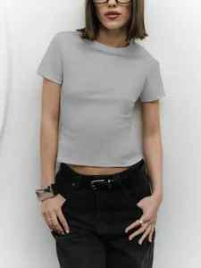 Close-up of a gray slim-fit crop top T-shirt with a crew neck and short sleeves