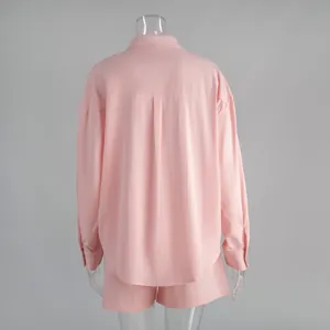 Back view detail of pink textured cotton long-sleeve shirt and matching shorts lounge set