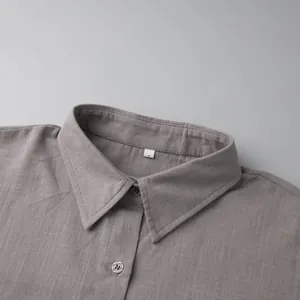 Close-up of a pure cotton shirt collar showing fabric texture and stitching details