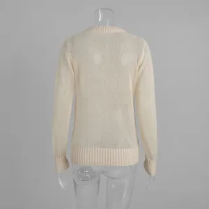Detailed back view of a semi-sheer cream mohair knit sweater on a clear torso mannequin