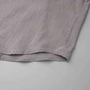 Detailed macro shot of grey cotton linen fabric texture and hemline for women's set