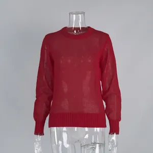 Detail view of the red semi-sheer mohair knit sweater showing the fine ribbed texture.