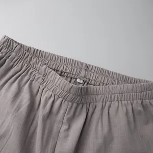 Close-up of elastic waistband on grey cotton casual shorts detail view