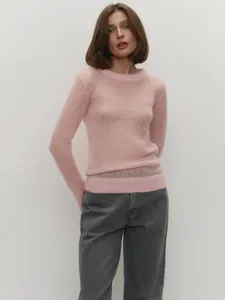 Detailed view of a soft pink semi-sheer mohair knit sweater with a classic crewneck
