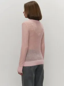 Back detail of a pink semi-sheer mohair crewneck sweater for women's soft knit wear