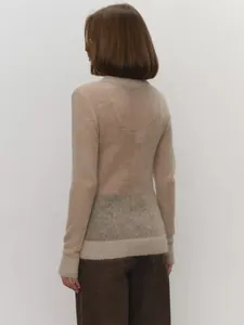 Rear view of a premium semi-sheer beige mohair knit sweater showing delicate texture and fit