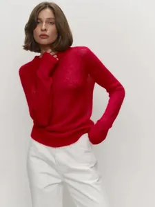 Detailed close-up of a soft red mohair crewneck sweater featuring delicate knit texture