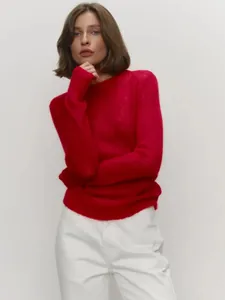 Detailed texture of red mohair round neck sweater for women in studio lighting