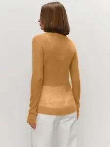 Rear view of a sheer mustard yellow mohair crewneck pullover sweater for women