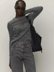Close-up of a gray mohair crew neck sweater with a semi-sheer knit texture.