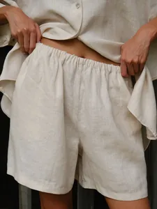 Close-up of women's linen shorts with elastic waistband from a summer resort set
