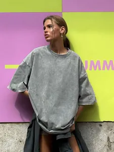 Trendy street style oversized gray acid washed distressed T-shirt worn by model