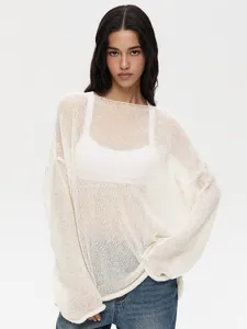 Detail of white sheer hollow out knit sweater with flare sleeves for women.