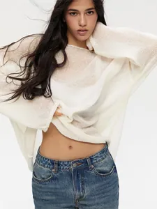Elegant white hollow-out knit sweater featuring a scoop neck and stylish bell sleeves.