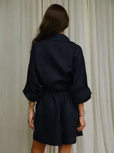 Detailed back view of a navy blue loose-fit linen shirt and shorts set for resort wear