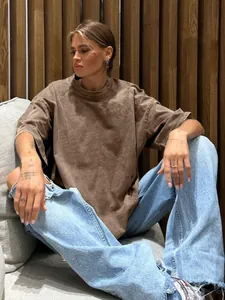 Oversized washed distressed brown T-shirt with vintage crew neck for a casual look.