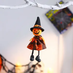 Detailed view of the hanging pumpkin witch doll for festive Halloween decorations