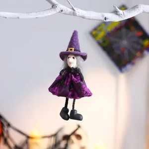 Close-up detail of a handmade purple Halloween witch doll hanging ornament decoration