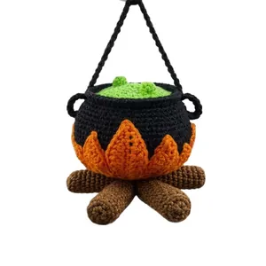 Handmade crochet Halloween witch cauldron decoration with campfire base and hanging strap