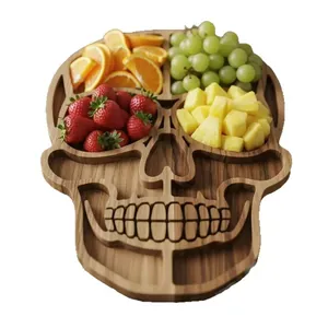 Halloween skull-shaped wooden charcuterie board filled with colorful fresh fruit slices