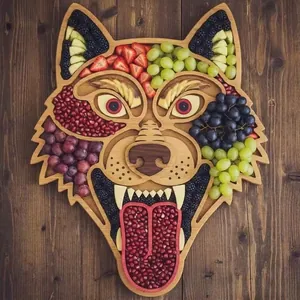 Detailed view of a wolf-shaped wooden charcuterie board filled with colorful fruits.