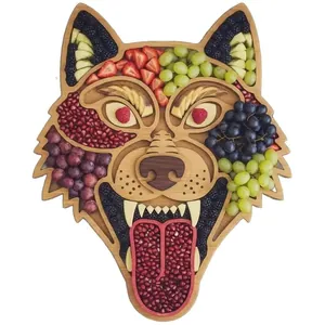Wolf shaped wooden charcuterie board with multiple sections for festive food display