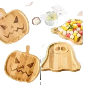 Decorative Halloween wooden pumpkin and ghost shaped serving trays for spooky party table