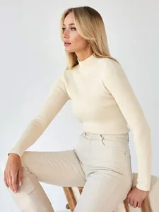 High-quality detail of a cream ribbed mock-neck sweater for women with slim fit knit design