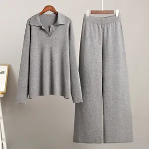 A premium grey knitted two-piece set featuring a Polo collar sweater and wide leg pants