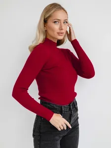 Model wearing a dark red ribbed mock neck sweater, slim fit knitwear for women's winter fashion