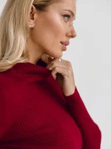 Detail of burgundy ribbed mock neck sweater showing fine knit texture and slim fit
