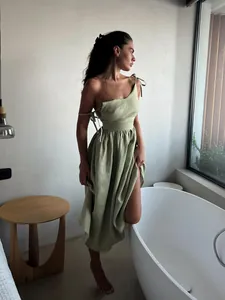 Elegant sage green linen-blend backless maxi dress with adjustable tie shoulder straps