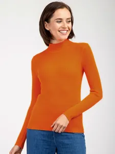 Close-up view of orange ribbed mock neck sweater showing slim fit texture