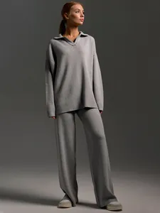 Full view of casual gray knitwear set with polo collar sweater and wide-leg trousers