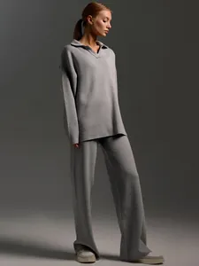 Professional studio shot of grey Polo neck knit pullover and matching wide-leg trousers.