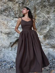 Elegant chocolate brown V-neck maxi dress with tie straps and backless detail shot