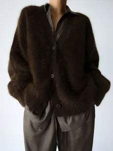 Close-up of oversized dark brown faux mink fur cardigan with a soft, fuzzy texture