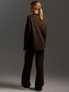 Back view of a cozy dark brown knitted two-piece lounge set with wide-leg pants.