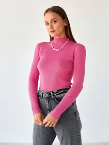 Professional detail shot of pink ribbed mock neck slim-fit knit sweater for women